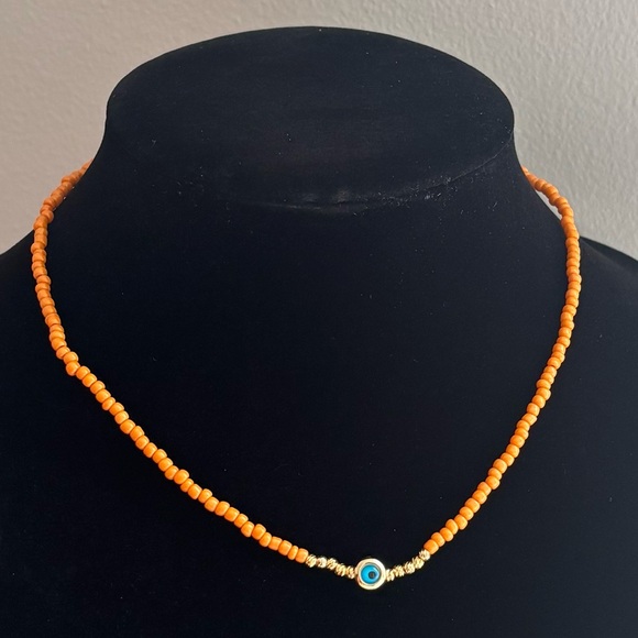 Jewelry - Orange Beaded Necklace with Blue Accent